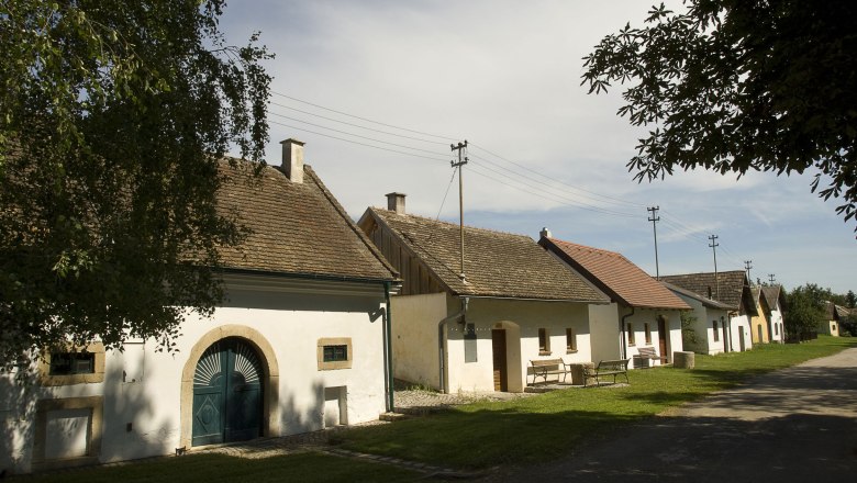 Wine cellar lane in Schöngrabern, © Rita Newman Row of wine cellars in Schöngrabern, Austria, in sunny weather.