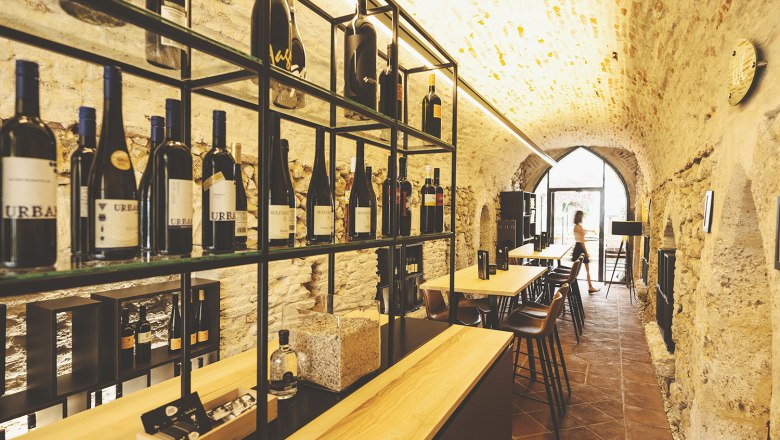 Weinviertel wines, © Michael Reidinger Wine cellar with bottle racks and tables in a vault.