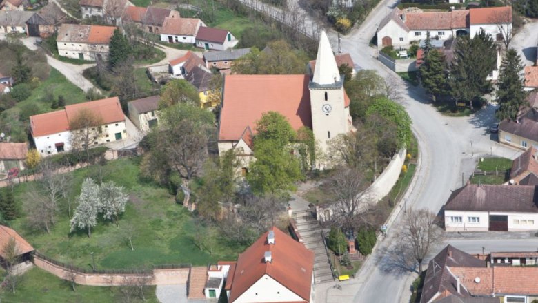 Aerial view of Altlichtenwarth church in a village with surrounding houses and streets.