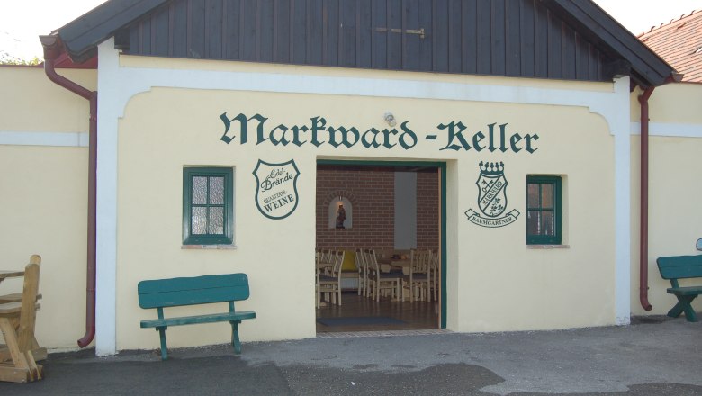 Entrance to the Markward cellar with benches and open gate.