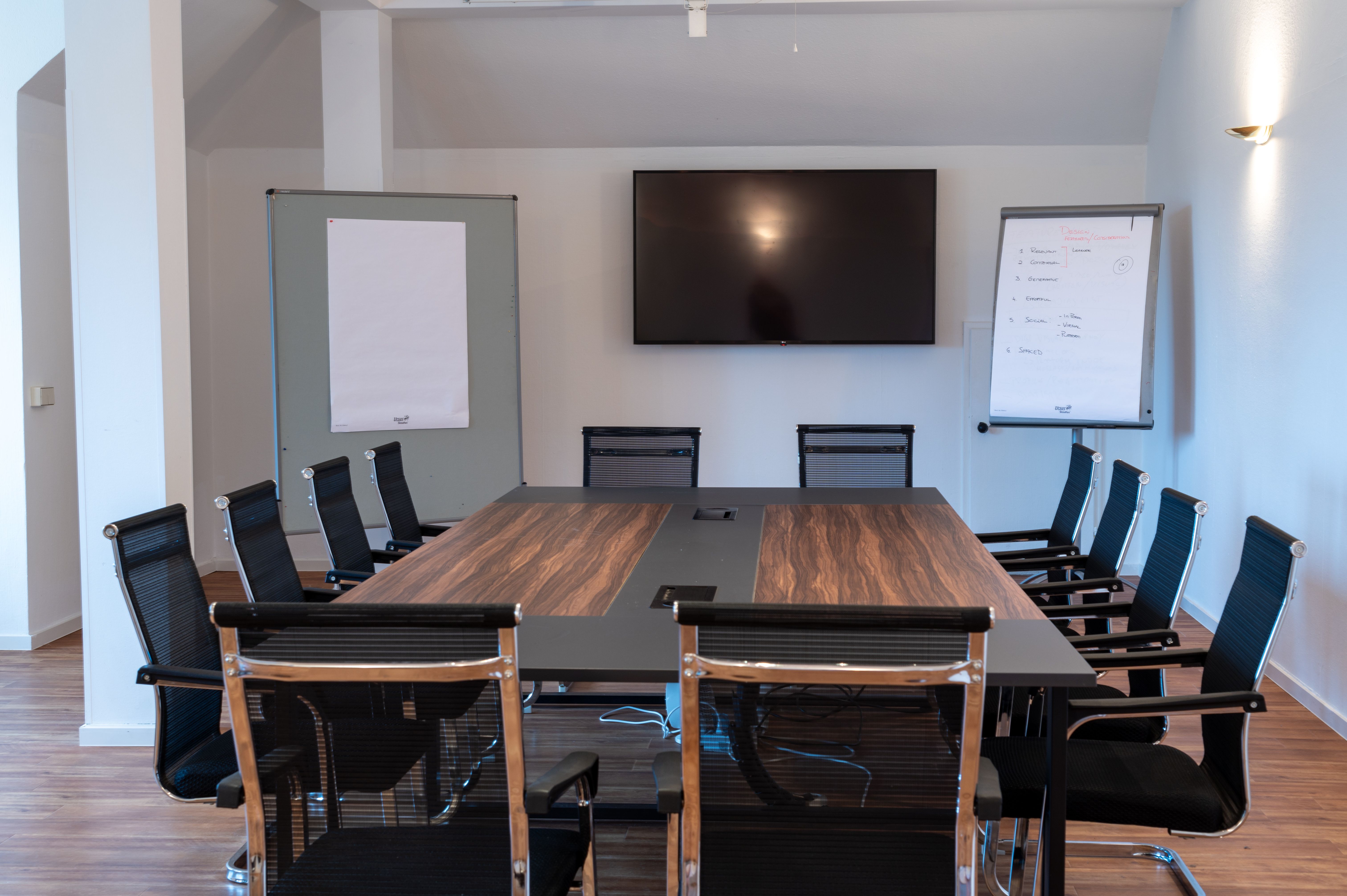 Seminar room with table and chairs and screen