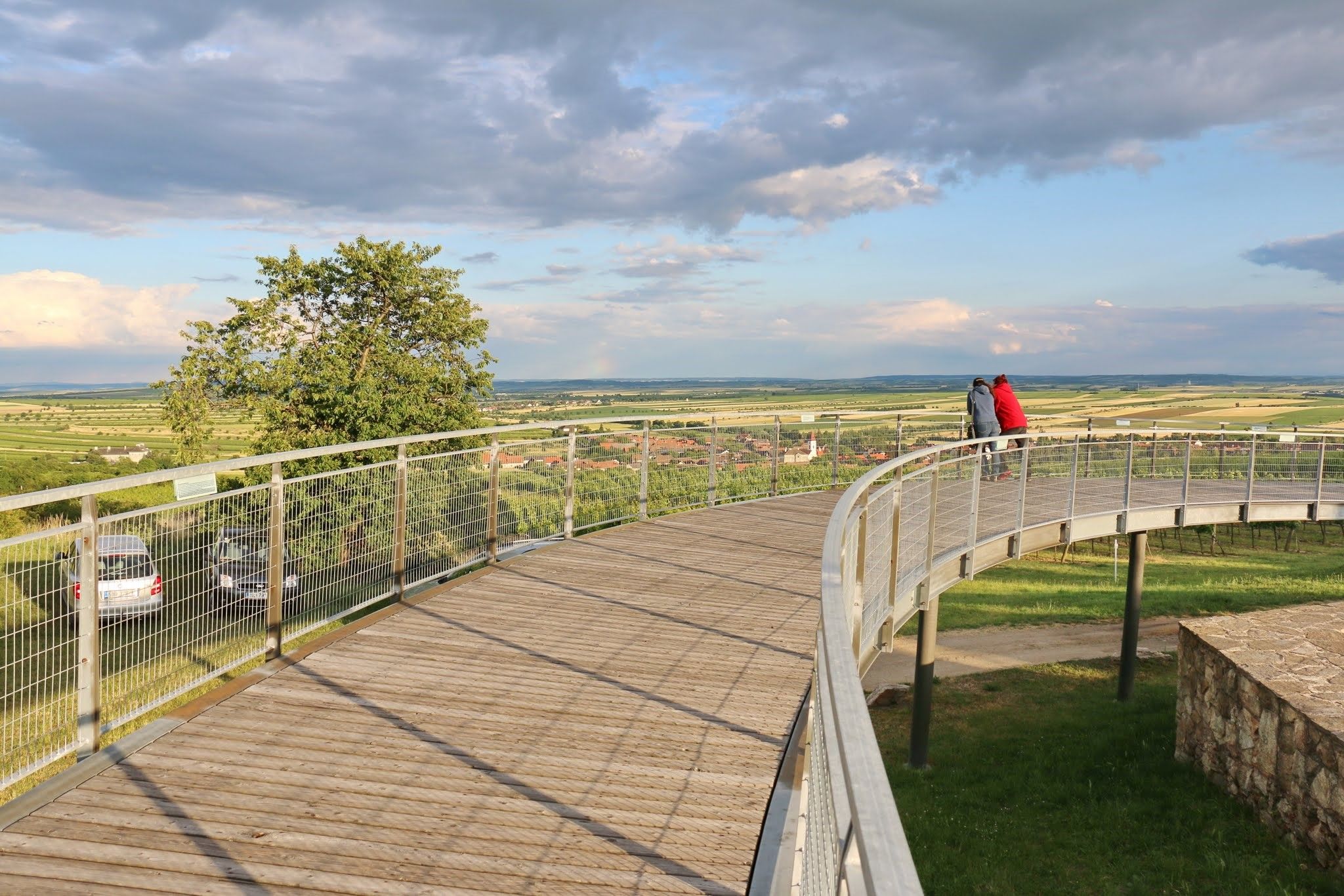 Viewing platform with two people looking at the landscape.