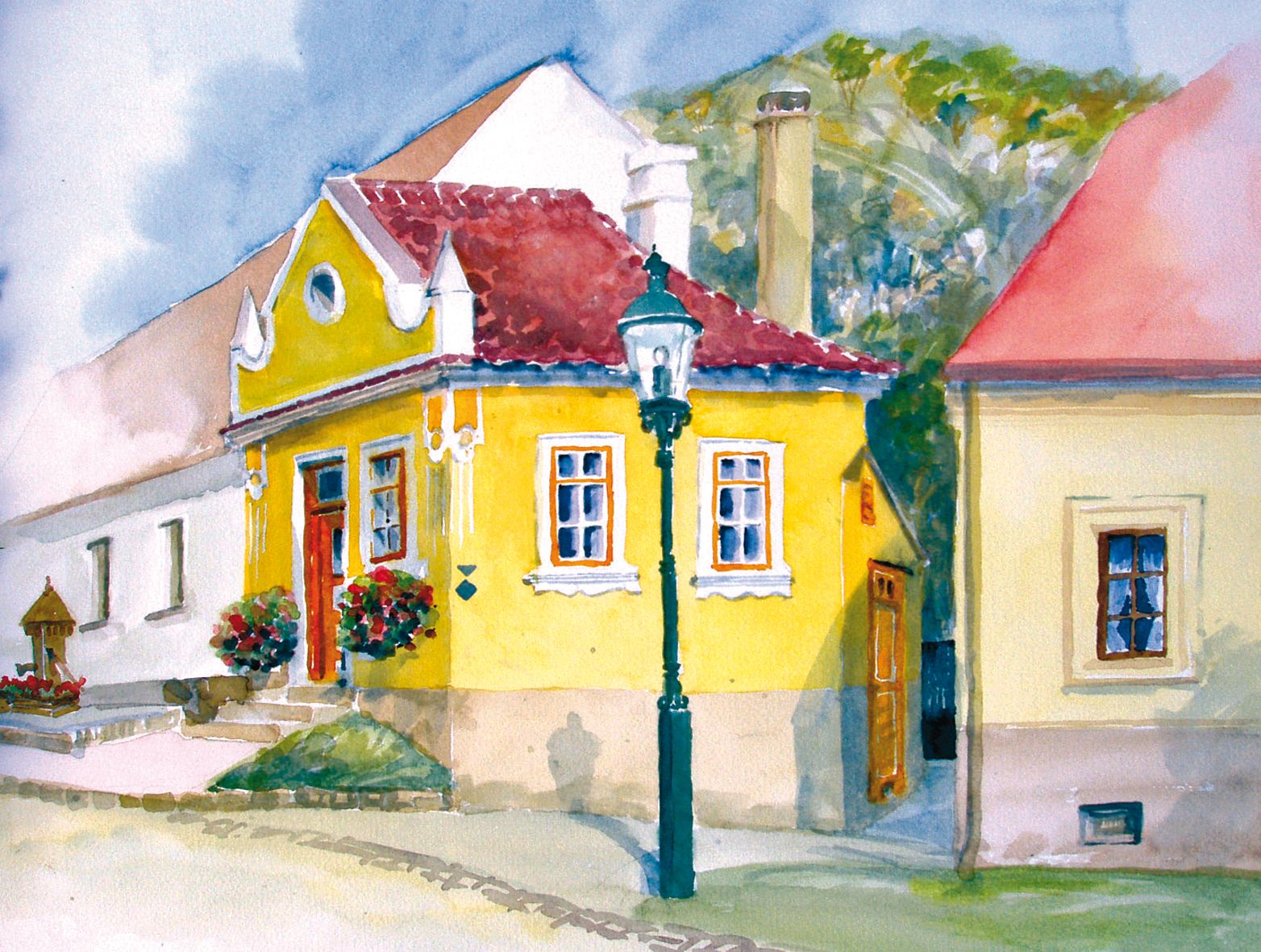Watercolor of a yellow house with red roof tiles and flowers in front of the windows.