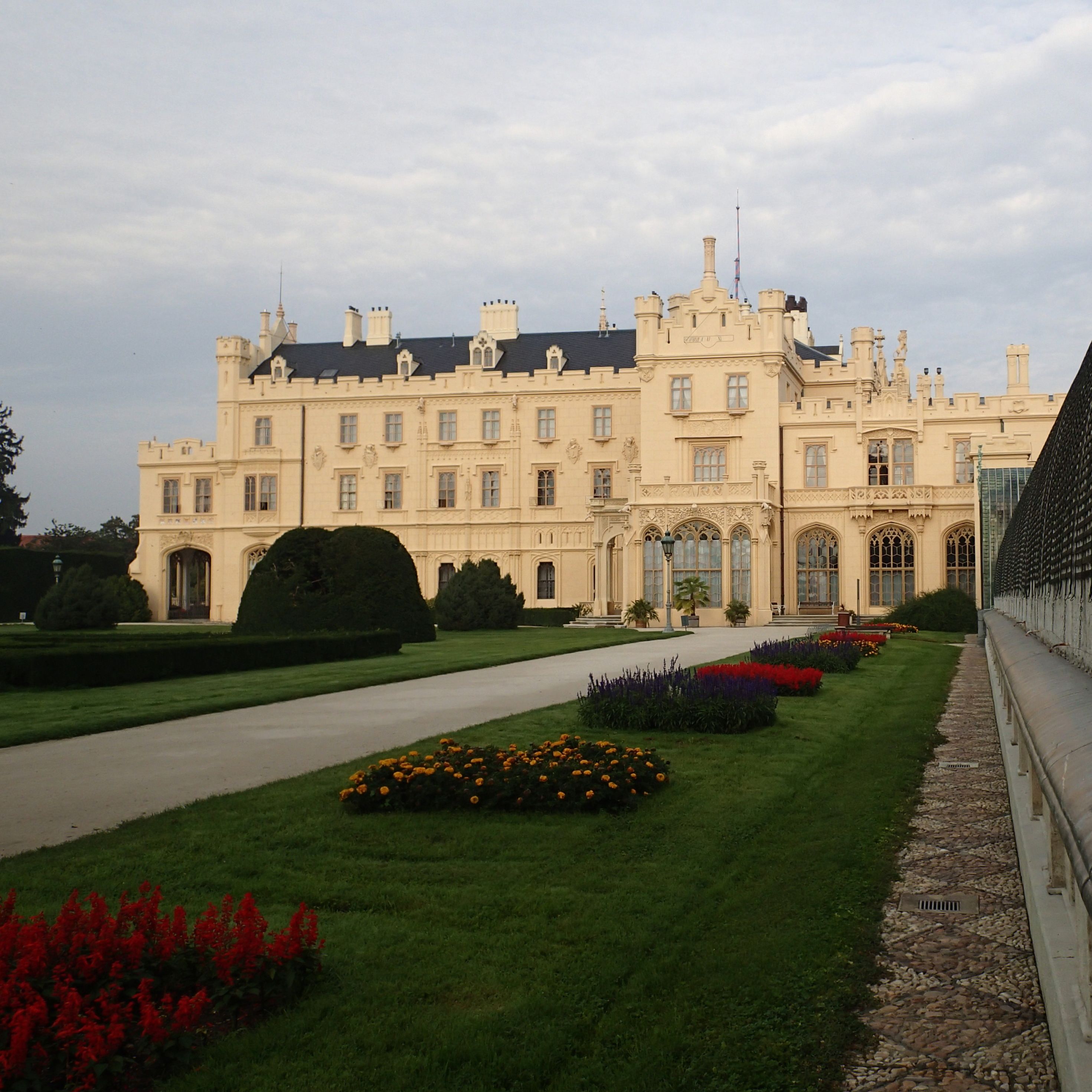 Lednice Castle with manicured gardens in the foreground.