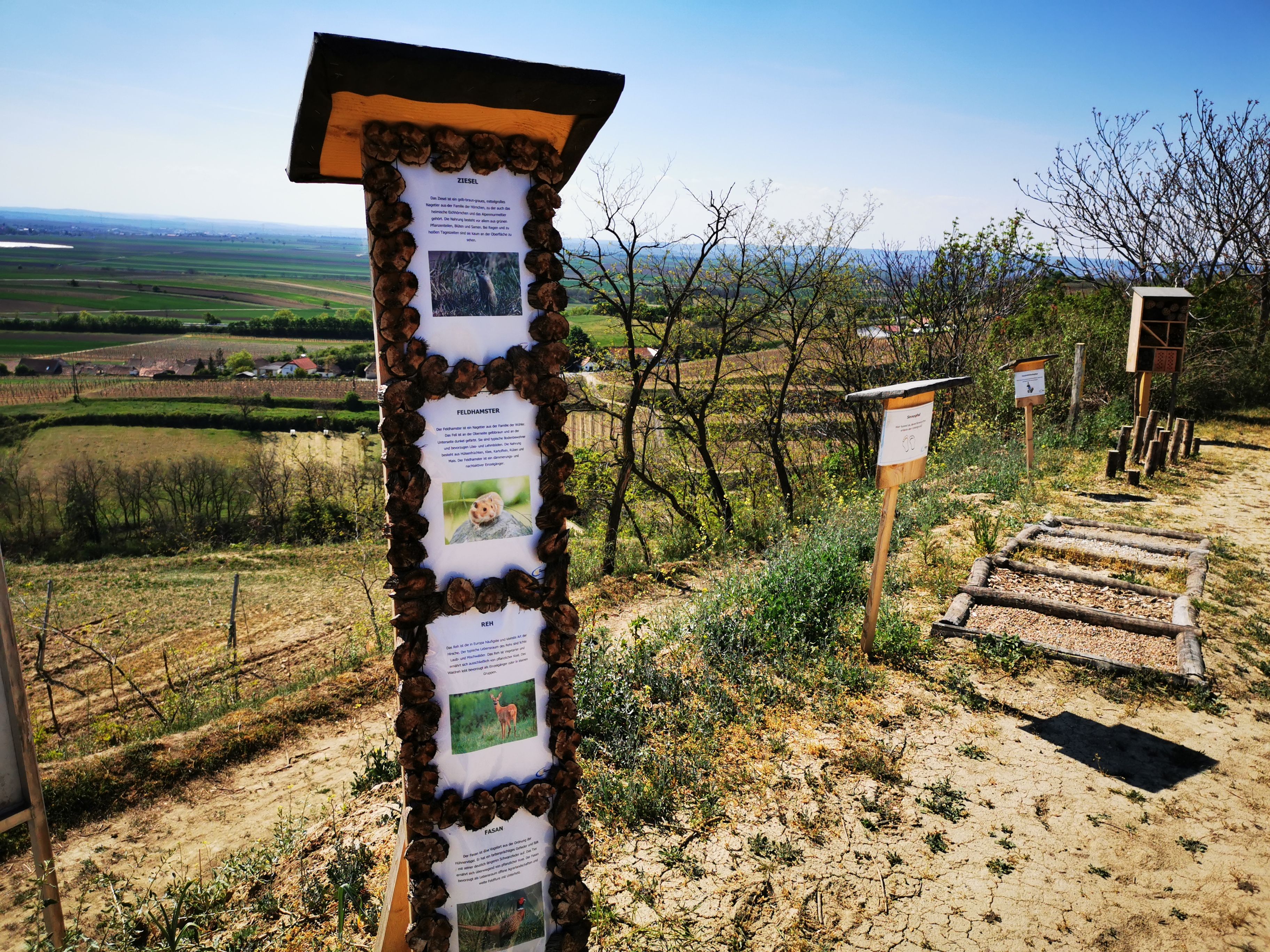Educational trail with information boards in a rural landscape.