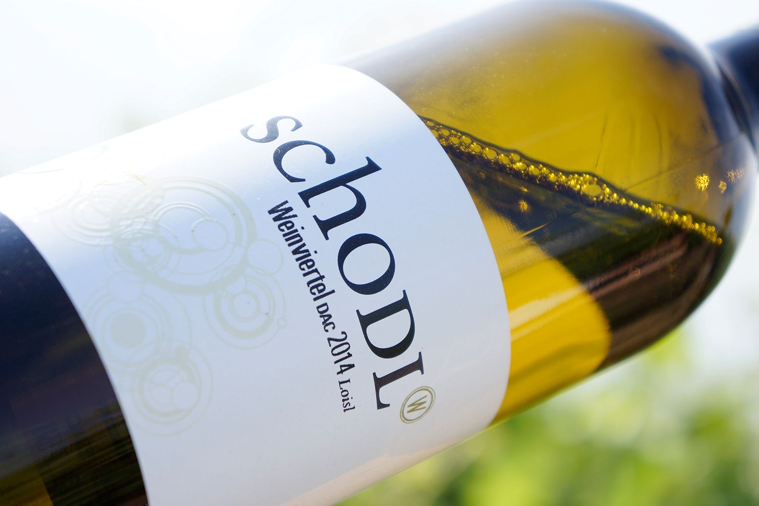 Close-up of a wine bottle with the label 'Schodl Weinviertel DAC 2014 Loisi'.