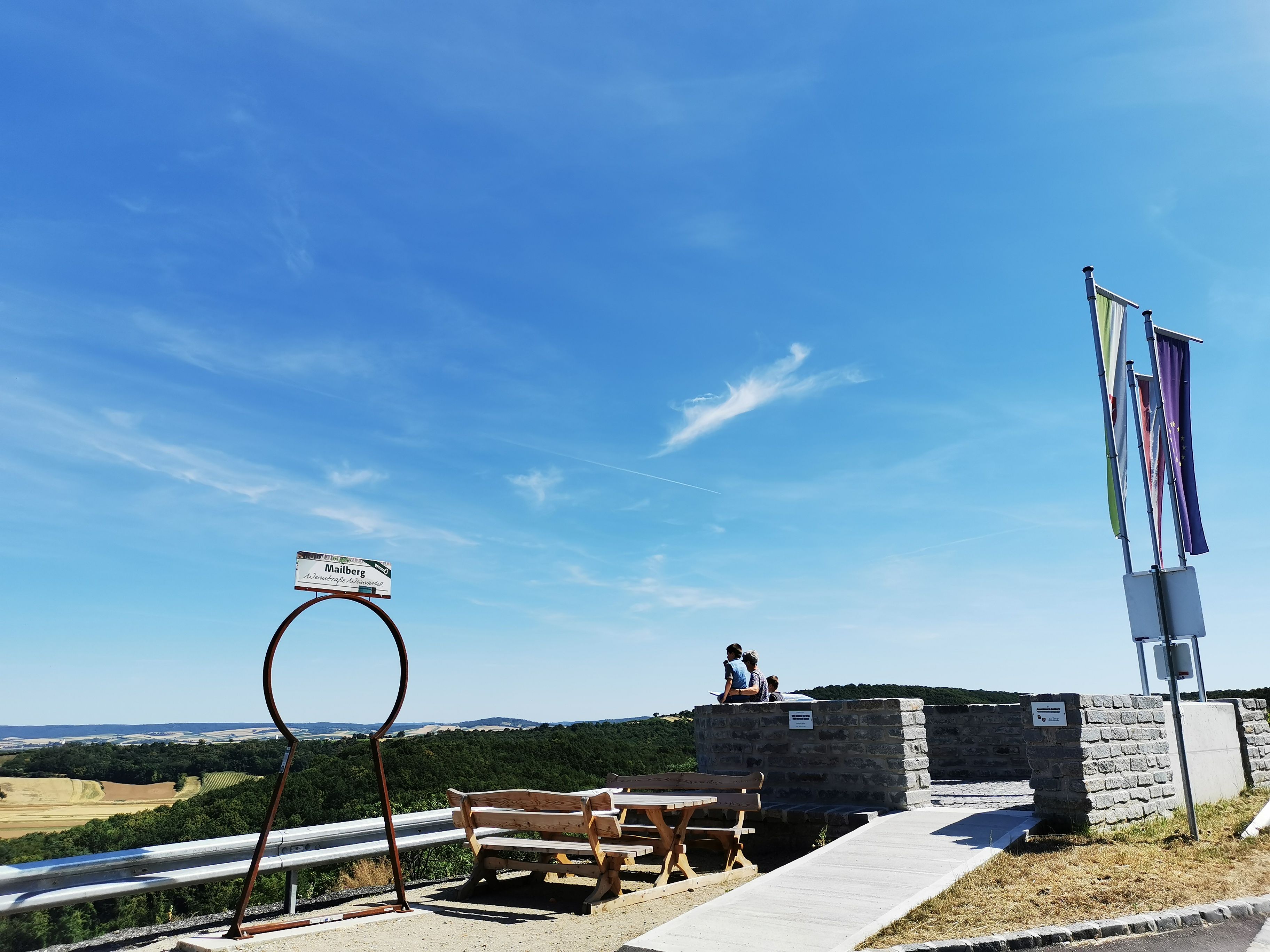 Viewpoint with benches and flags, view of the landscape.