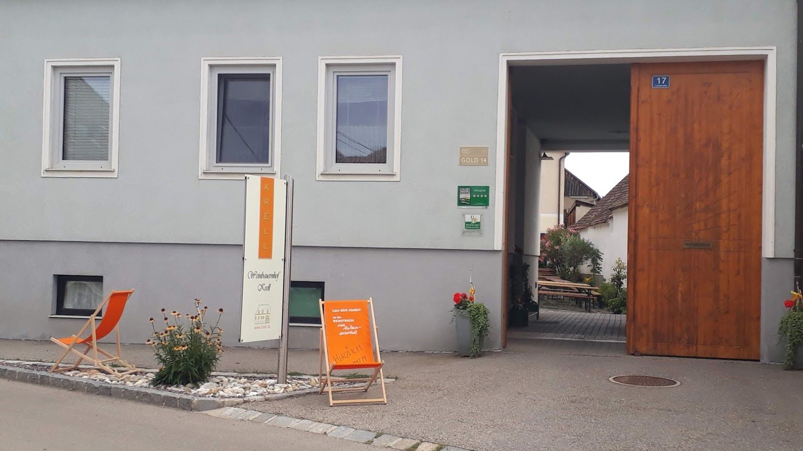 Entrance to a winery with 'Krell' sign, deckchair and plants.