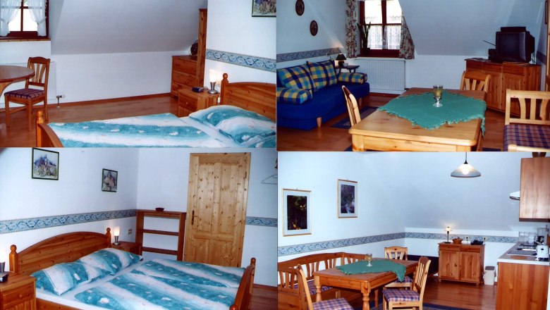 Innenansicht einer gemütlichen Ferienwohnung mit Holzmöbeln, Bett, Sofa und Esstisch.