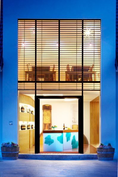 Modern tasting room with large windows and wooden elements.