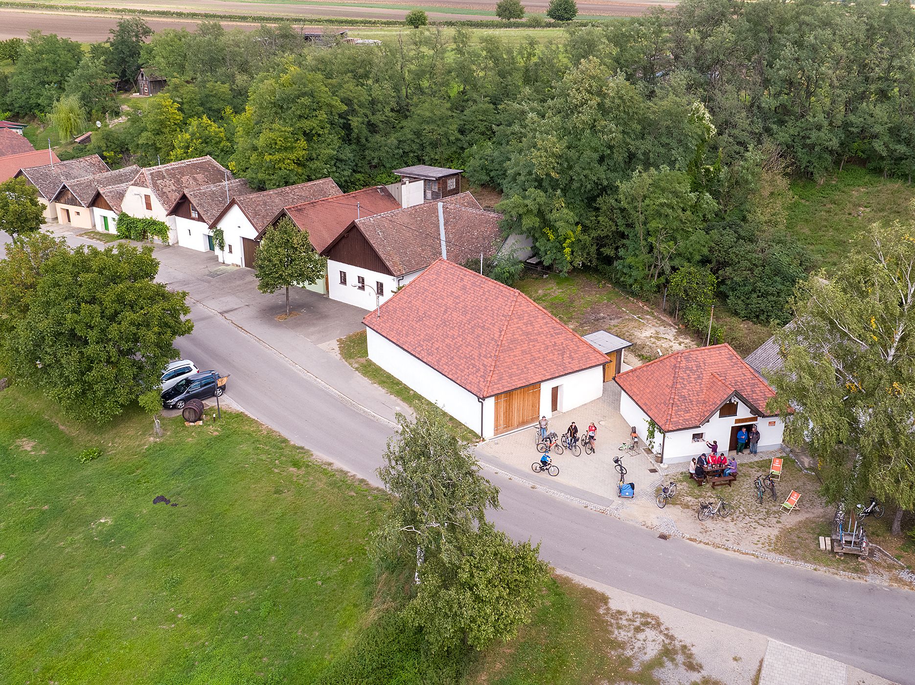 Aerial view of Jetzelsdorf with traditional buildings and people on bicycles.
