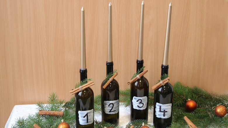 Weinviertler Variante des Adventkranzes mit dunklen Flaschen, © Weinviertel Tourismus